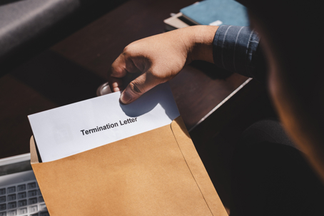 Man receiving a termination letter at work