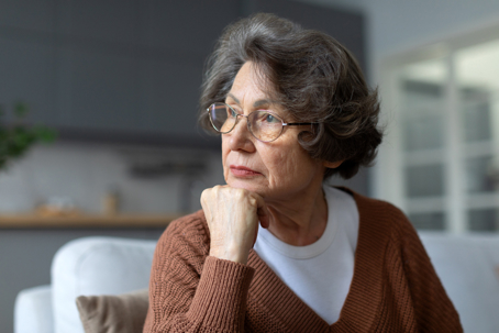 Older woman discerning whether she was fired justly or not